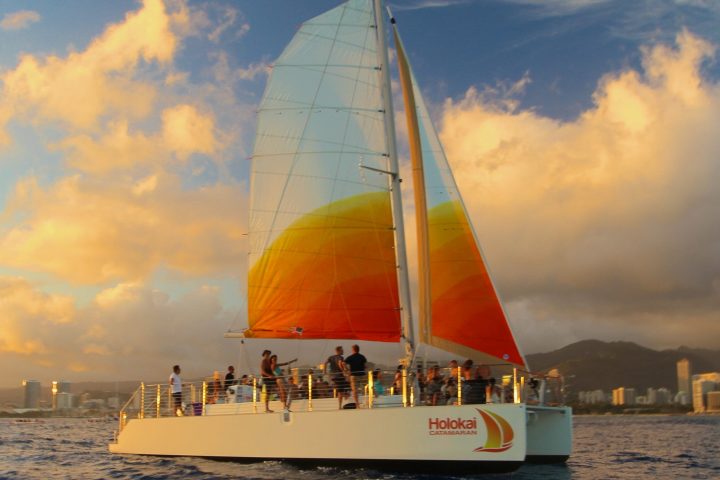 The Holokai Catamaran at sea outside of Waikiki on the Sunset Sail Private Charter