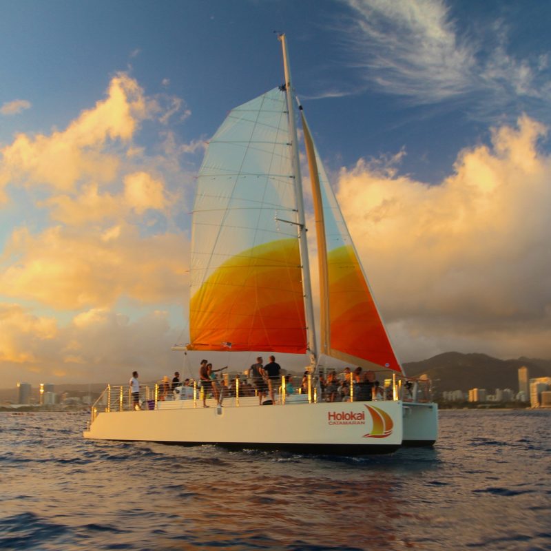 The Holokai Catamaran at sea outside of Waikiki on the Sunset Sail Private Charter