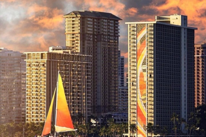 a large body of water with a city in the background