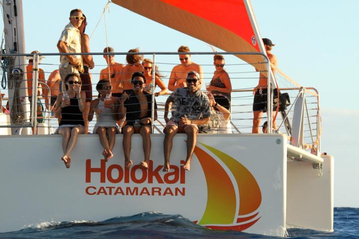 a group of people on a boat in the water