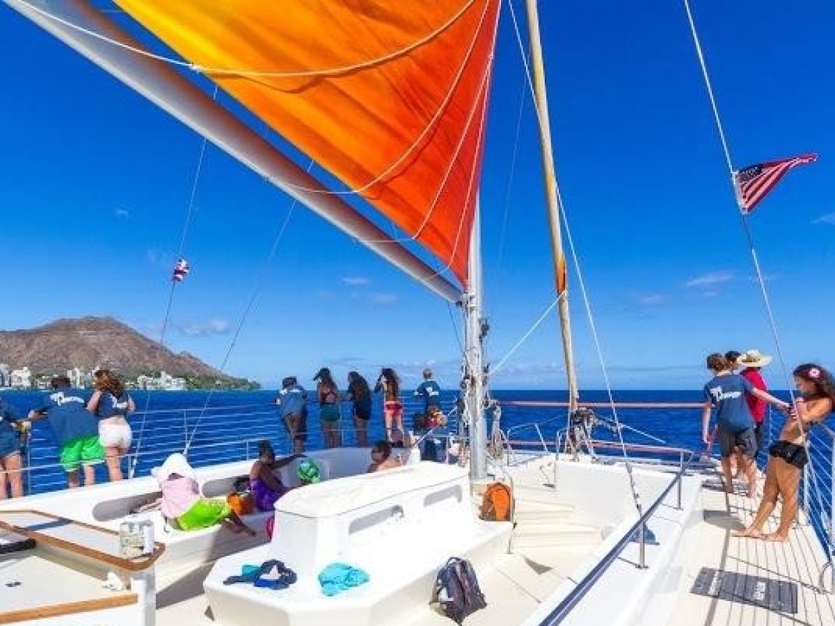 Photo of the deck of the Holokai Catamaran while the boat is sailing on the Turtle Canyon Sail
