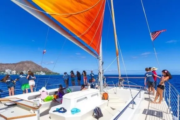 a group of people flying kites on a boat