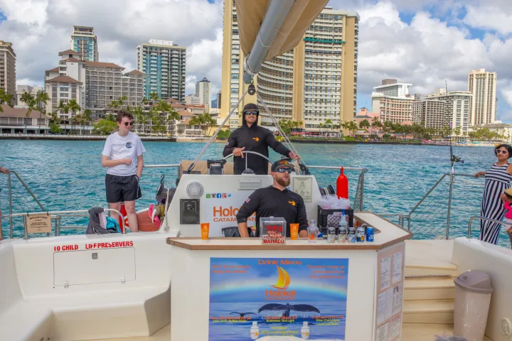 a group of people on a boat in the water