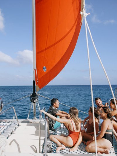 a group of people in a boat on a body of water