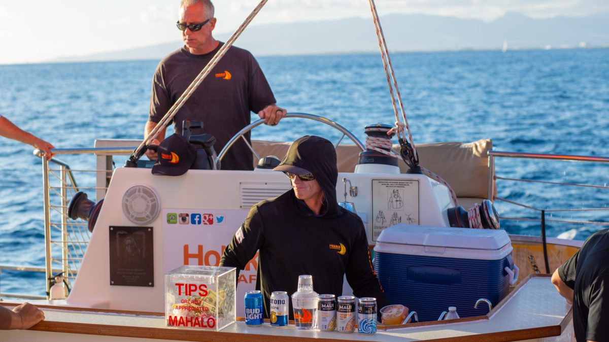 a group of people in a boat on a body of water